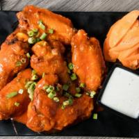 Wings · Five medium sized wings tossed in your choice of sauce, served with celery and choice of dre...