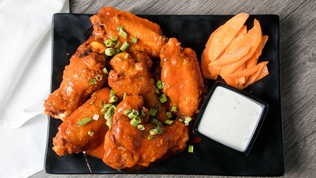 Wings · Five medium sized wings tossed in your choice of sauce, served with celery and choice of dressing.