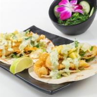 Fish Tacos (2 Pc) · Crispy flounder, spring and power mix tossed in ginger vinaigrette, topped with mango salsa ...