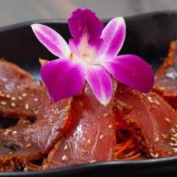Tuna Tataki · Pepper encrusted tuna, seared rare and served with ponzu sauce. Light and refreshing starter...