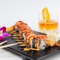 Lkn Roll · Tempura shrimp, cream cheese, topped with smoked salmon, spicy sauce and eel sauce.
