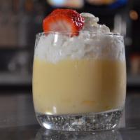 Mango Pudding · Gluten-free. Topped with whipped cream and strawberry.