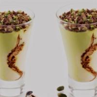 Coppa Pistachio · Custard Gelato Swirled together with chocolate and pistachio gelato, topped with praline pis...