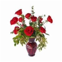 Dozen Roses · Premium dozen rose bouquet. Greens and filler.
Glass vase.

Color may vary depending on avai...