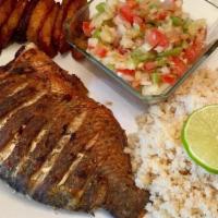 Atieke Fish Tilapia · Atieke with choice of Tilapia or Red Snapper and a side of Plantains.