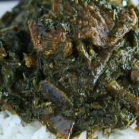 Cassava Leaves Soup With Lamb  · Cassava leaves with meat with a side of white rice or fufu.