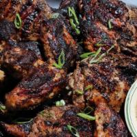 Jerk Chicken  · Jerk Chicken with white rice or rice and beans and a side.