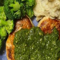 Pesto Chicken Dinner · Grilled chicken breast topped with a fresh basil pesto sauce served with garlic mashed potat...