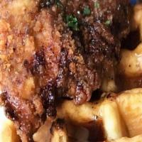 Chicken & Waffles · Juicy chicken tenders fried until golden atop two fluffy Belgian waffles along with homemade...