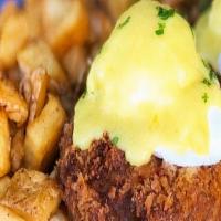 Crab Cake Benedict · Two award winning crab cakes placed atop a toasted English muffin topped with two poached eg...
