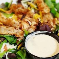 Blackened Chicken Salad · Roasted corn, diced tomatoes, green bell peppers, and Cheddar cheese on a bed of mixed green...