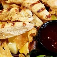Asian Chicken Salad · A juicy grilled chicken breast atop a bed of mixed greens with mandarin oranges, pineapple, ...