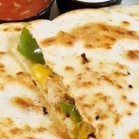 Chicken Quesadillas · Juicy grilled chicken breast, roasted green peppers, and onions, diced jalapeños, cheddar ja...