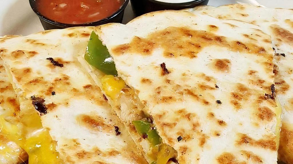 Chicken Quesadillas · Juicy grilled chicken breast, roasted green peppers, and onions, diced jalapeños, cheddar jack cheese blend, all stuffed in a large flour tortilla. Served with side of spicy salsa and sour cream.