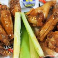 Wings 10 Ct - Half & Half · 5 wings of one flavor & 5 wings of a second flavor.  Served with a choice of ranch or blue c...