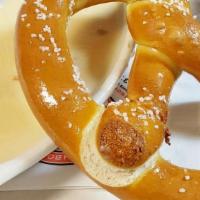 Beer Cheese Pretzel Dip · Giant soft pretzel served warm with beer cheese dip made in house from our popular new Belgi...