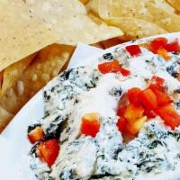 Spinach & Artichoke Dip · Creamy dip made from spinach & artichoke hearts blended with cheeses. Served with corn torti...