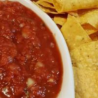 Chips & Salsa · Spicy salsa housemade from all fresh ingredients. Served with corn tortilla chips.