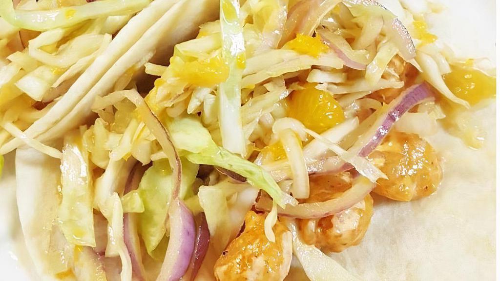 Spicy Shrimp · Two soft tacos stuffed with crunchy shrimp tossed in our special spicy sauce and topped with sweet Asian slaw.