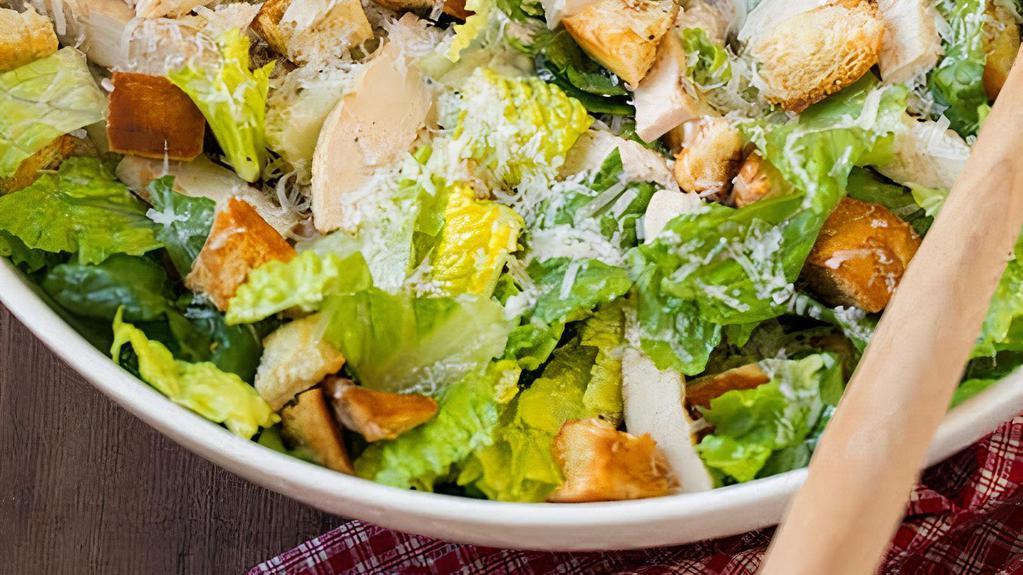 Chicken Caesar Salad · Romaine lettuce, thinly sliced grilled chicken, homemade croutons, caesar dressing and shredded Parmesan cheese.