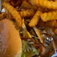 Bacon Cheeseburger Combo · Single patty burger combo w cheese lettuce tomato & pickle w/ season fries
