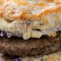 Sweet Country Blues · Cooper River Farms all-natural, clean label pork sausage on a glazed blueberry biscuit.