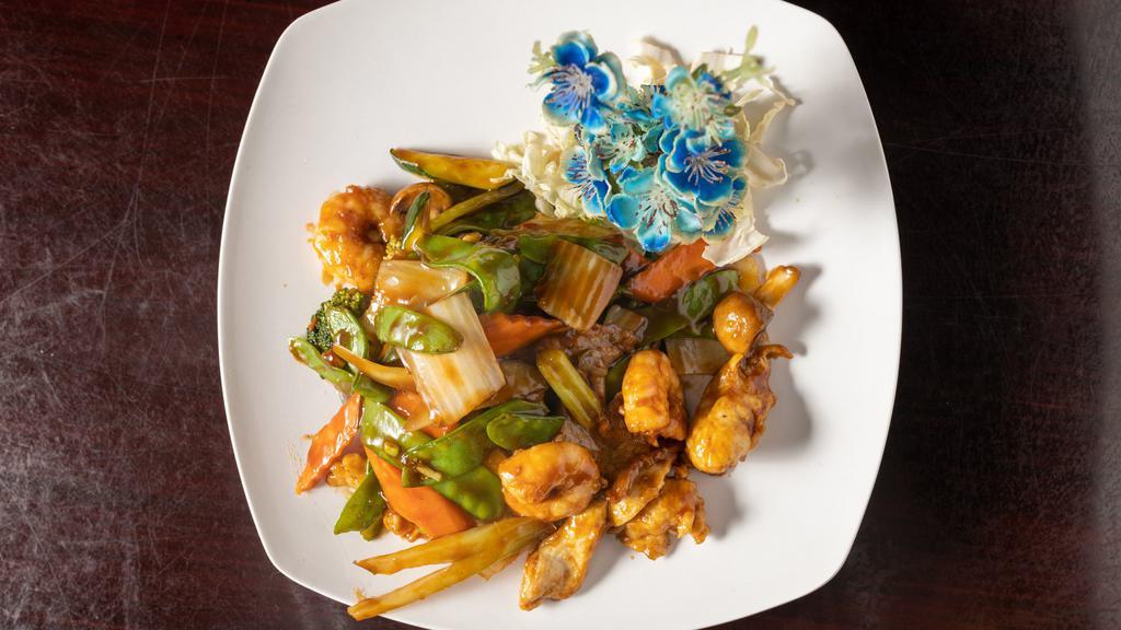 Triple Delight · Chicken, beef and shrimp with mushroom, asparagus, snow peas, broccoli and bok choy.