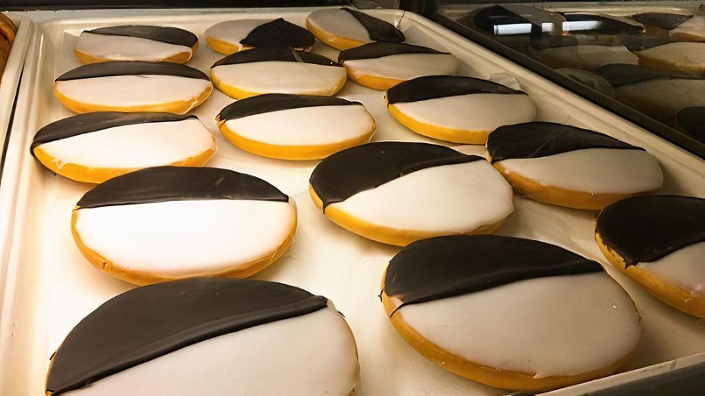Black & White Cookie · Half-moon cookies are slightly dome-shaped, have frosting on a fluffy angel cake base.