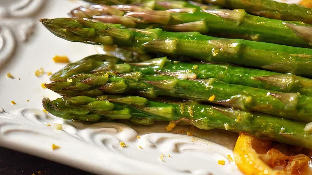 Sautéed Asparagus · Seasoned with garlic butter, olive oil, lemon zest, pepper & salt