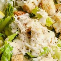 Classic Caesar Side Salad · Romaine lettuce, cherry tomatoes and grated parmesan cheese with caesar dressing.