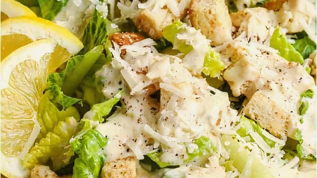 Classic Caesar Side Salad · Romaine lettuce, cherry tomatoes and grated parmesan cheese with caesar dressing.