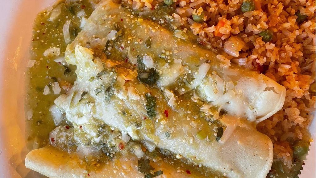 Enchiladas Verdes · Three enchiladas, one cheese, one chicken, and one beef. Topped with cheese and green sauce. Served with rice and beans.