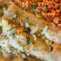 Spinach Enchiladas · Three enchiladas stuffed with fresh baby spinach and topped with cheese sauce. Served with r...