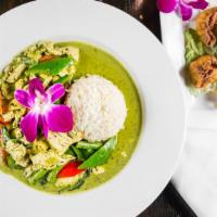 Green Curry · Sweet green curry. Meat of your choice simmered with zucchini, bell peppers, green beans, eg...