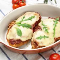 The Chicken Parmesan · Lightly fried parmesan-breaded chicken breasts are smothered with homemade marinara sauce an...