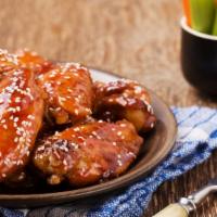 Teriyaki Chicken Wings · Golden-crispy chicken wings dipped in teriyaki sauce.