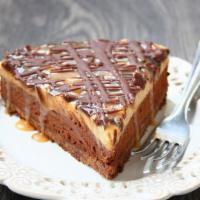 Caramel Peanut Butter · Topped with Snickers candy bars. A heavenly combination of peanut butter Mousse. chopped Sni...