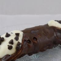 Chocolate Cannoli · Tube-shaped Chocolate shells of fried pastry dough Dipped in chocolate, filled with a sweet ...