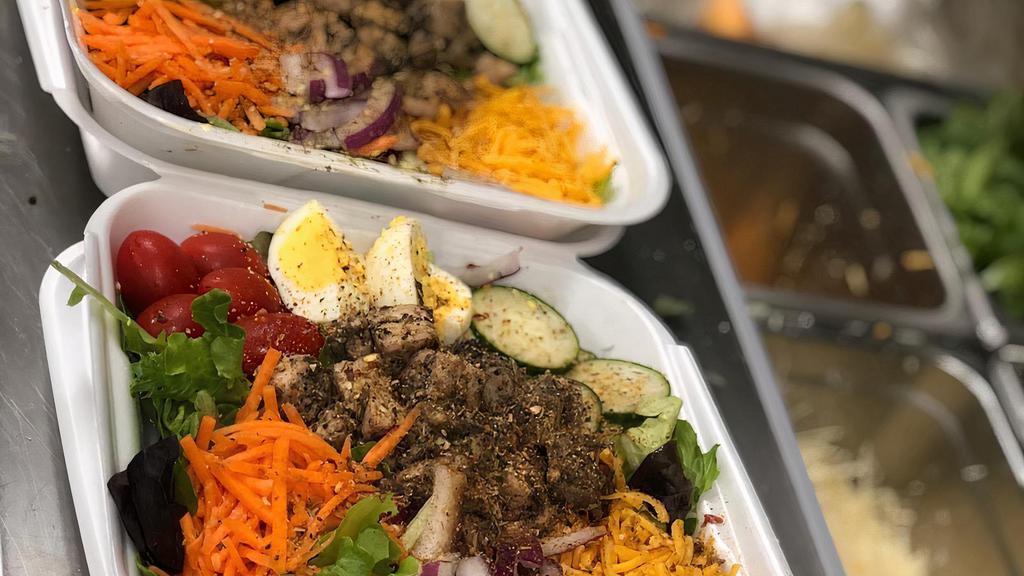 Salad · We take fresh mixed greens, cherry tomatoes, cucumbers, shredded carrots, and your choice of protein(jerk chicken, shrimp, salmon(add. $4)) assorted dressing avail.
