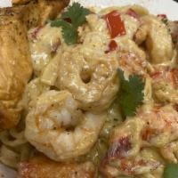 Bossmane Pasta · Lobster and crawfish fettuccine Alfredo pasta topped with a salmon filet, a lobster tail and...