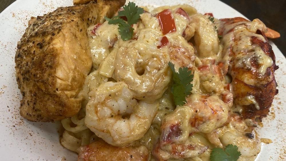 Bossmane Pasta · Lobster and crawfish fettuccine Alfredo pasta topped with a salmon filet, a lobster tail and 6 jumbo shrimp🤤
