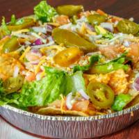 Loaded Nachos · Shredded chicken, cheese, lettuce, tomatoes, onions, and jalapeños.
