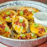 Potato Skins · Potatoes topped with cheese, bacon, and scallions. Served with sour cream.