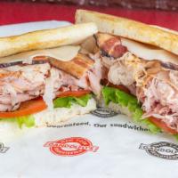 Wall Street Club Sandwich · Turkey, ham, roast beef, bacon, provolone, lettuce, tomato, mayonnaise, S&P, and butter on s...