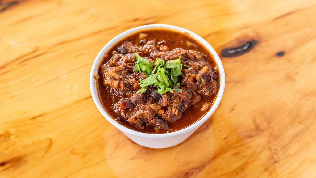 Small Chili · Homemade steakhouse style chili with  smoked brisket, pulled pork butt, flank steak, black and kidney beans, and chipotle pepper.