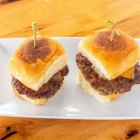 Burger Slider · A tri-blend of porter, chuck, and brisket, ground beef. King's Hawaiian rolls. Pickles. Aged...