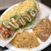 Chimichanga · Deep-fried burrito filled with your choice of meat, shredded cheese and refried beans. Toppe...