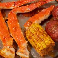 King Crab Legs · Served corn and potato.