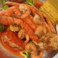 Seafood Platter (P4) · 1 Lobster tail, 1/2Lb snow crab legs and 1/2Lb shrimp. Served with 2 corn, 2 potato, egg and...