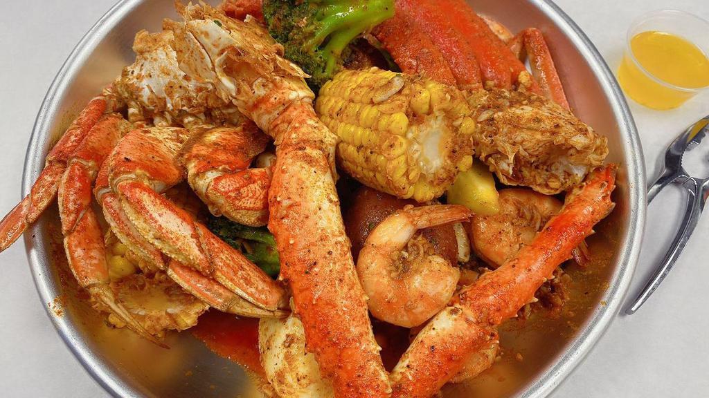 Seafood Platter (10) · 1/2 lb king crab leg, 1 cluster snow crab leg, 1 cluster Dungeness crab leg & 1/2 lb shrimp ( no head) Served with 2 corn, 2 potato, egg and broccoli.